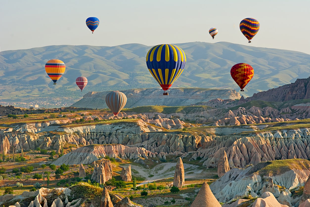 Cappadocia Colorful hot air balloons flying over the valley at Cappadocia